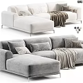 Modern L Shaped White And Gray Two Seater Sofa With Pillows And Blanket