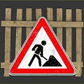 Road Work Warning Sign Featuring Shoveling Man Symbol And Wooden Barrier