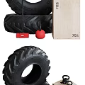 Strength Training Tire With Kettlebells And Wooden Box In Gym Setup