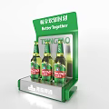 Tsingtao Beer Bottles And Beer Glasses On Green Display Shelf With Better Together