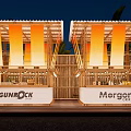 Commercial Outdoor Seating Areas With GUNROCK Morgan Signage Wooden Structures And Orange Nighttime Lighting