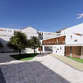 Modern School Building with White Exterior Courtyard Green Trees and Paved Ground