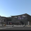 Modern Commercial Street Featuring Glass Facade Curved Design Outdoor Seating And Pedestrians