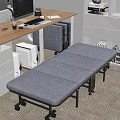 Comfortable Gray Foldable Sofa Bed In Modern Office Workspace Near Desk And Cabinets