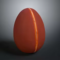 Red Egg Shaped Food With White Vertical Line In Center