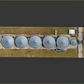 Industrial Metal Silos Agricultural Storage Facility With Grassy Area And Equipment