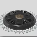Black Circular Mechanical Component With Central Mesh Panel And Outer Gear Like Structure