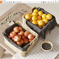 Fresh Red Apples and Yellow Lemons in Wicker Baskets on Wooden Table with Olive Branch