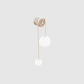 Minotti Modern Wall Lamp With Brass Frame And White Spherical Shades On Beige Wall