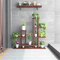 Multi Tiered Wooden Plant Stand With Various Green Plants And Potted Flowers In Balcony Corner