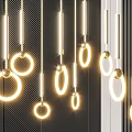 Modern Illuminated Chandeliers With Circular Glowing Rings Hanging On Dark Wall Background
