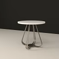 Modern Side Table With White Round Top And Sleek Metal Legs Design