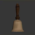 Vintage Brass Bell With Polished Wooden Handle On Reflective Black Surface