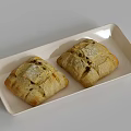 Two Freshly Baked Crusty Country Bread Loaves on White Rectangular Ceramic Plate