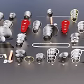 Various Red And Silver Metal Pendants With Diverse Shapes And Designs