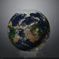 Realistic Earth Globe With Blue Oceans Green Landmasses And White Clouds
