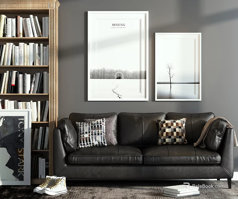 Black Leather Two-Seater Sofa With Plaid Pillows Wooden Bookshelf And Decorative Paintings On Gray Wall 3d model 