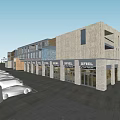 Modern Commercial Street with Beige Stone Facades Multiple Shop Fronts Glass Windows and Parking Area