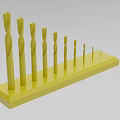 Industrial Equipment Yellow Drill Bits Set With Various Sizes Organized On Stand