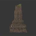 Ancient Stone Tower Structure With Layered Base And Grass On Top
