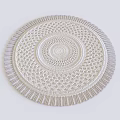 Round Handwoven Rug With Intricate Circular Pattern And Fringe Trim