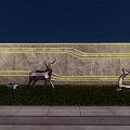 Feature Wall Night View With Stone Texture Yellow Strip Lighting And Deer Sculptures On Grass