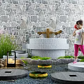 Serene Garden Courtyard With Stone Wall Fountain Lush Greenery Stepping Stones and Child Playing