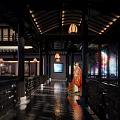 Traditional Ancient Chinese Architecture Corridor With Hanging Lanterns And Red Costume Figure