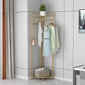 Gold Metal Clothes Rack With Hanging Clothes And Handbags Storage Basket In Modern Bedroom Interior