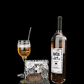 Wine Bottle And Glass With Amber Liquid And Zebra Pattern Accessory On Black Background
