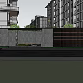 Contemporary Entrance Gate With Gray Wall Wooden Slats And Green Plants In Modern Residential Area