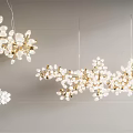 Modern Elegant Chandelier With Gold White Floral Branch Shapes Hanging From Ceiling