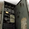 Commercial Electrical Equipment Metal Distribution Boxes With Rust Graffiti And High Voltage Warning Sign