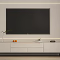 Modern White TV Stand With Large Black TV Screen Plant Oranges Books and Black Device