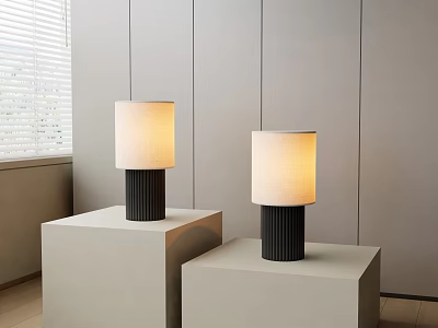 Two Modern Table Lamps With Black Bases And Cream Lampshades On White Cube Pedestals 3d model
