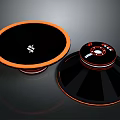 Modern Black And Orange Circular Electronic Speakers With Stylish Design
