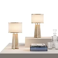 Two Table Lamps with Marble Bases White Fabric Shades on Table with Glassware Decorative Box