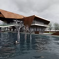 Modern Museum Building Over Water With Wooden Structure Large Windows Deer Sculptures And Water Reflection