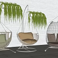 Stylish Hanging Chairs With Cushions And Green Plants On Outdoor Patio