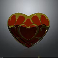 Elegant Heart Shaped Decorative Ornament With Red Center And Gold Decorative Patterns