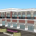 Traditional Commercial Street Architecture With Arched Windows Awnings Balcony Railings Flower Beds And Benches