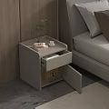 Modern Bedside Table With Open Drawer Small Plant Cup And Book Next To Bed