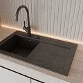 Black Undermount Kitchen Sink With Modern Faucet Light Colored Countertop And Textured Wall Tiles