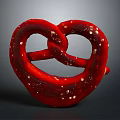 Heart Shaped Red Pretzel Snack With White Sesame Seeds On Dark Background