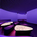 Modern KTV Lounge With Purple Lighting Curved Sofas Illuminated Tables And Stylish Ambiance