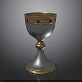 Ornate Silver Goblet With Gold Rim And Red Gemstone Accents