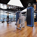Spacious Modern Gym Interior With Fitness Equipment And Wooden Floor