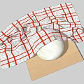 Red And White Checkered Cloth Covering Round Object On Wooden Cutting Board
