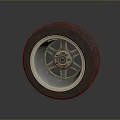 Car Tire With Alloy Wheel Rim And Red Center Cap On Gray Background
