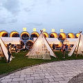 Outdoor Garden Ornaments With White Tents Palm Trees Stone Paths And Wooden Benches